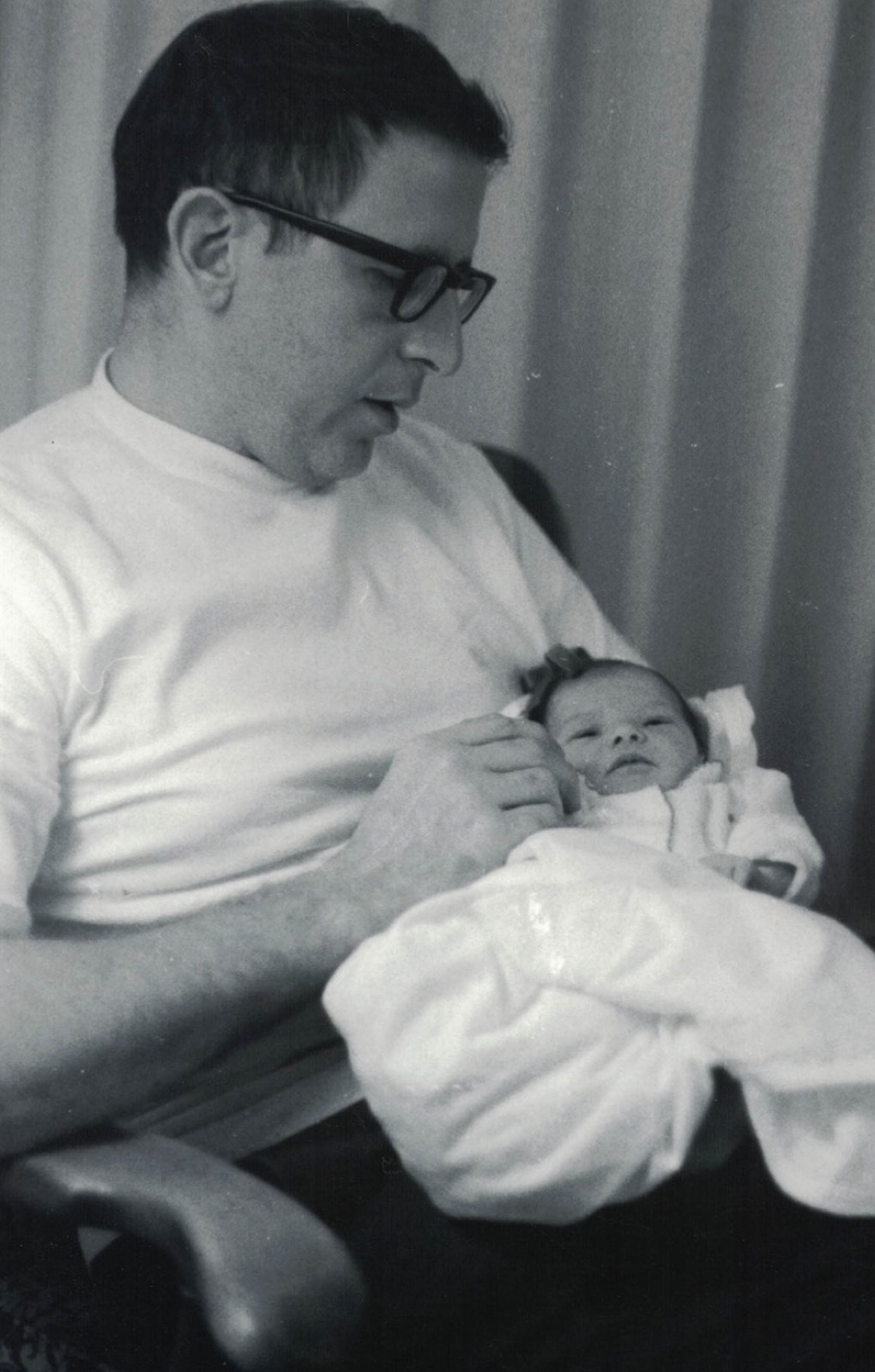 Dan holding newborn daughter Marci