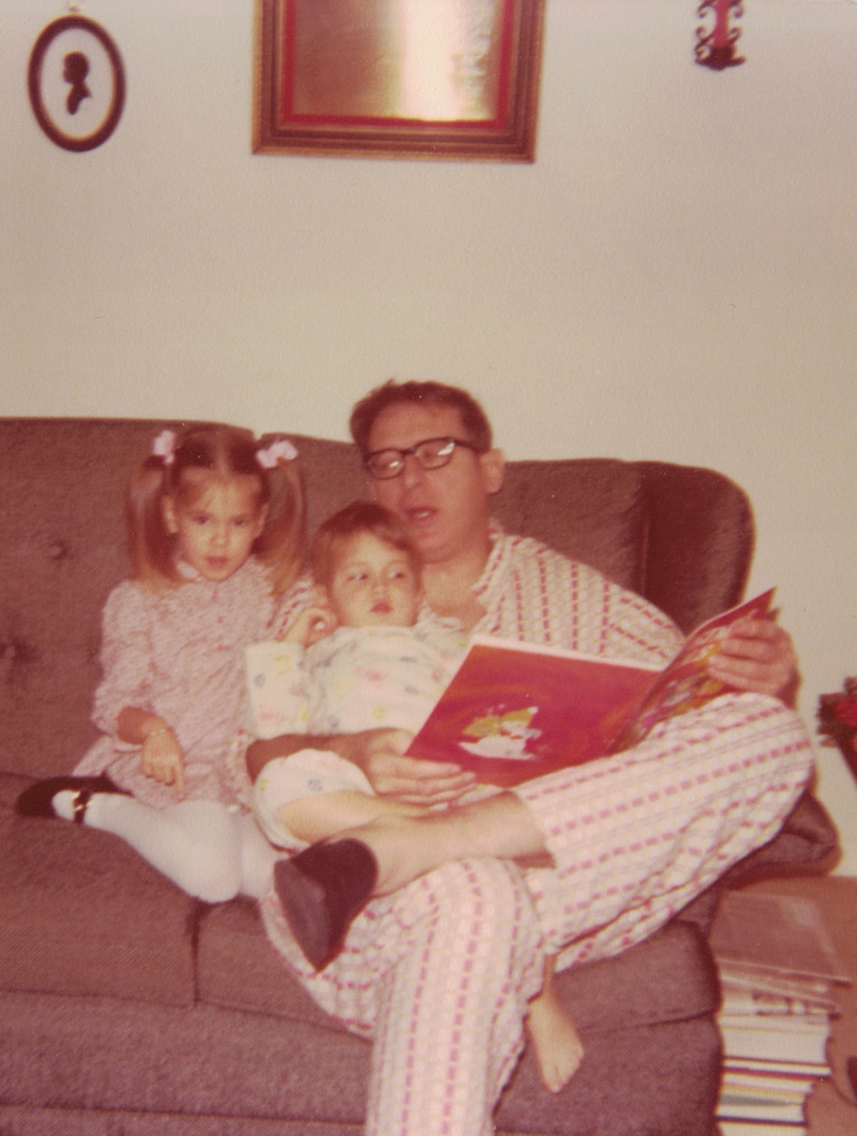 Dan reading to his children Marci and John